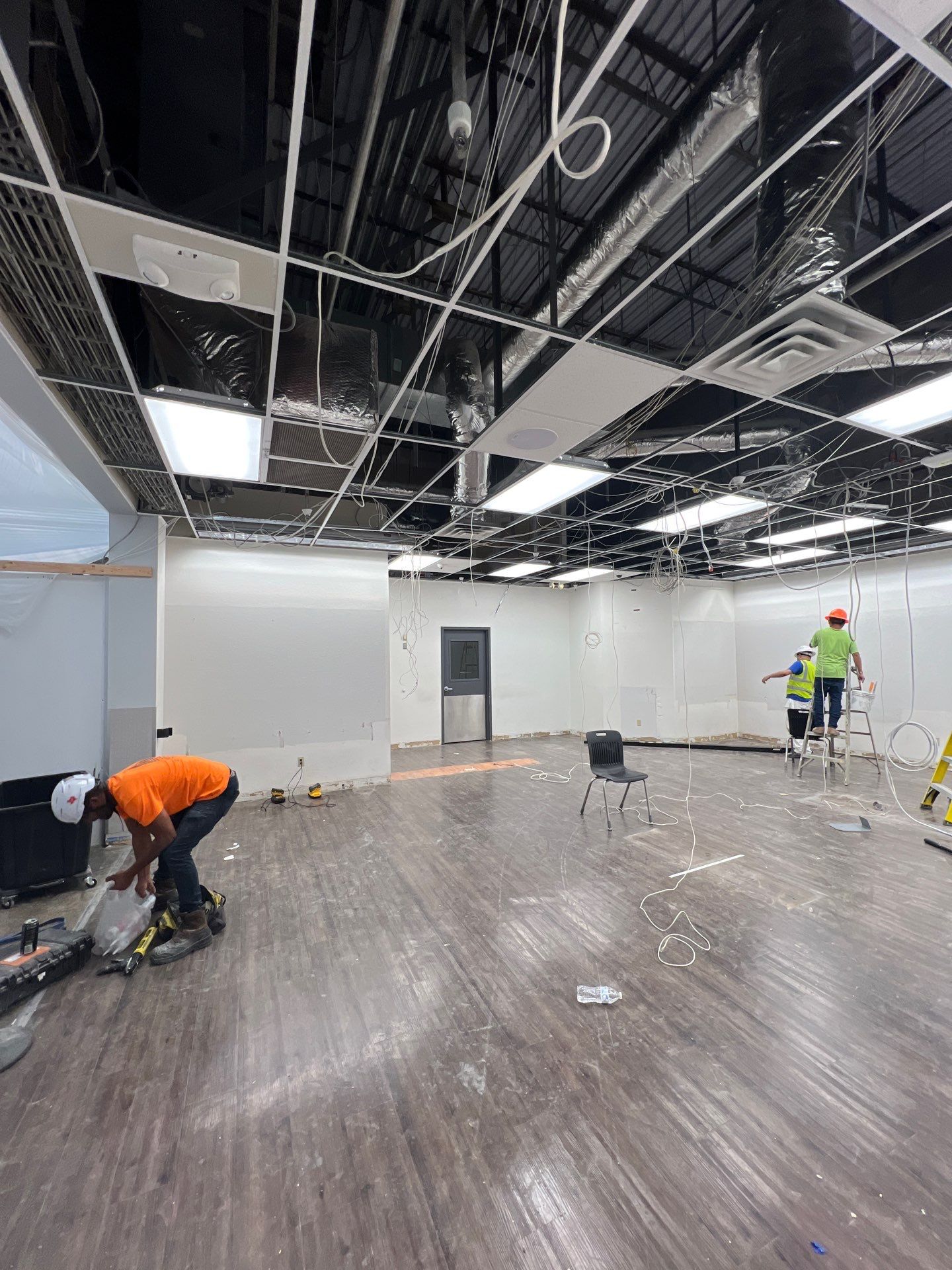 Carpentry crew coordinating an active back-of-house buildout